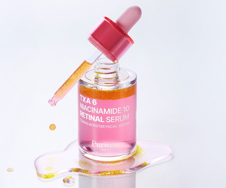 Sérum Purito Seoul TXA 6 Niacinamide 10 Retinal Serum avec sa pipette et une goutte de produit