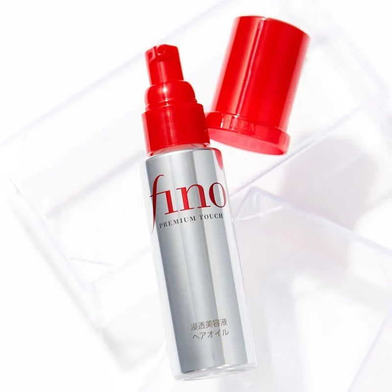 Huile capillaire FINO Premium Touch Hair Oil avec son capuchon rouge
